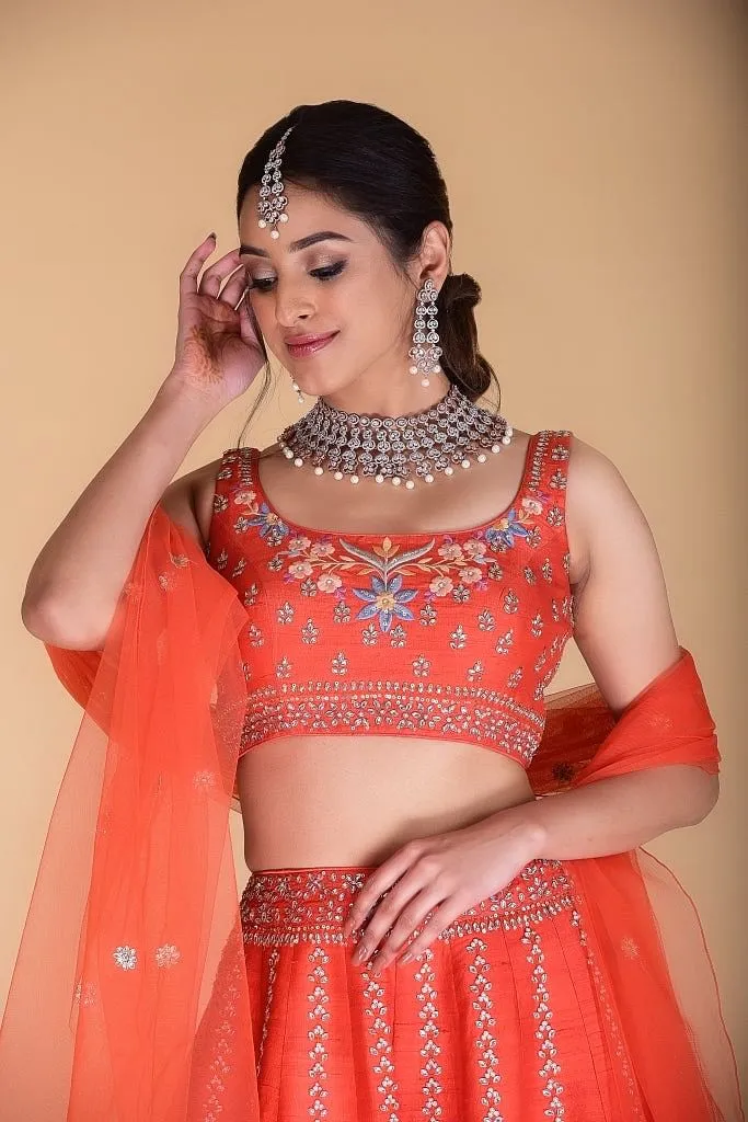 Bright Orange Embroidered Lehenga set.